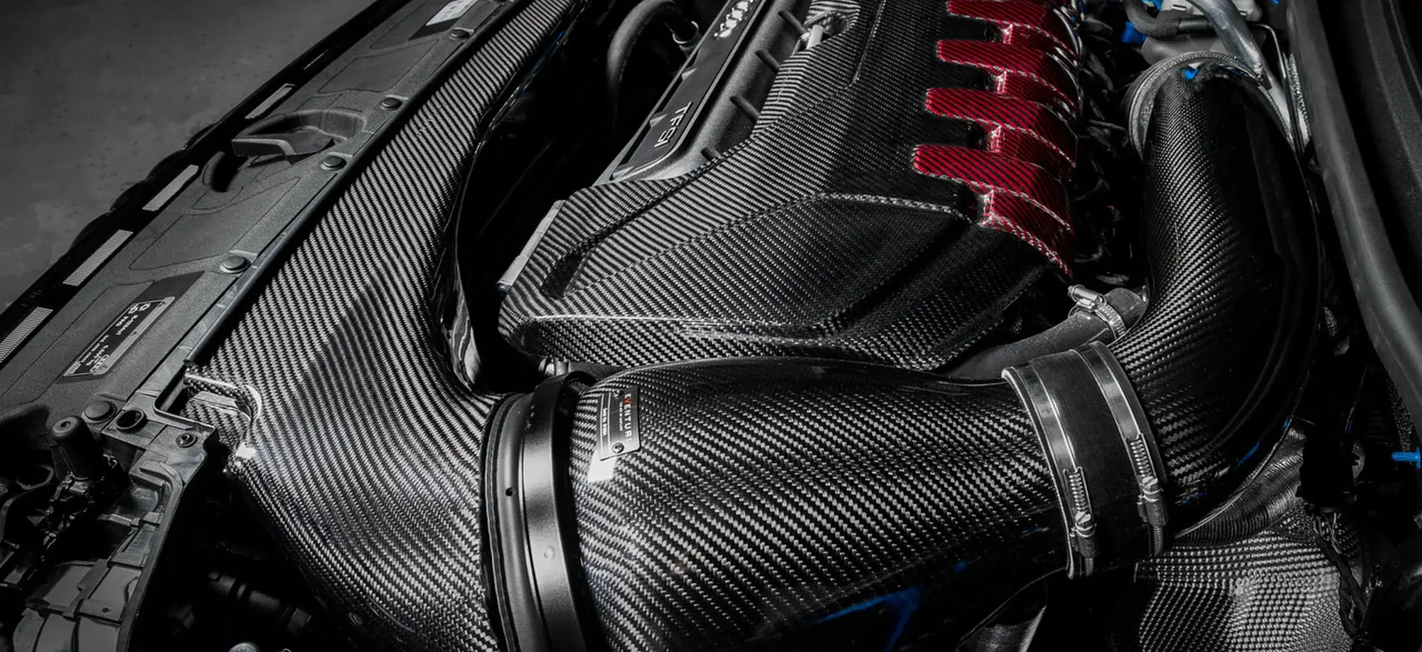 Carbon fibre intake system fitted in a modified engine bay