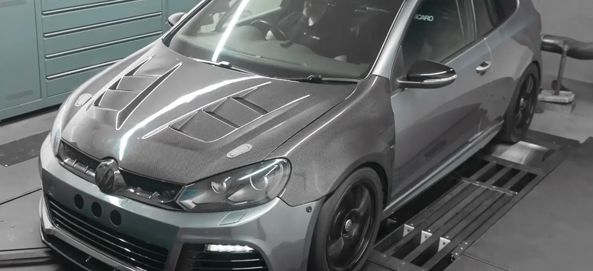 Modified hatchback strapped to a chassis dynamometer